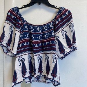 Floral over the shoulder shirt.